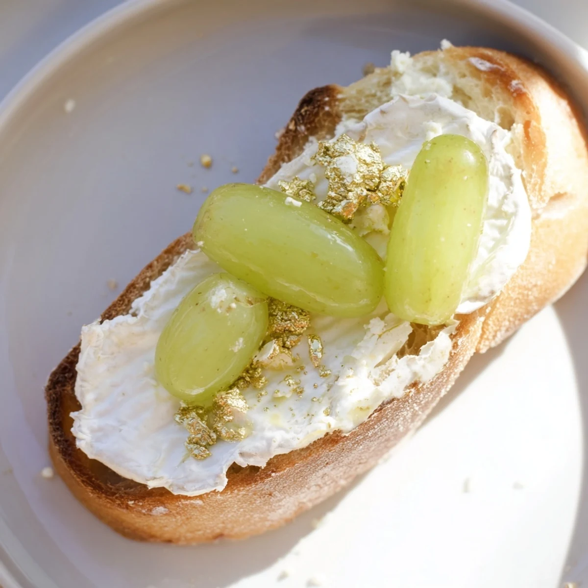 These decadent Sparkling Champagne Toast appetizers showcase white cheeses and bubbly prosecco-soaked grapes ready to eat.