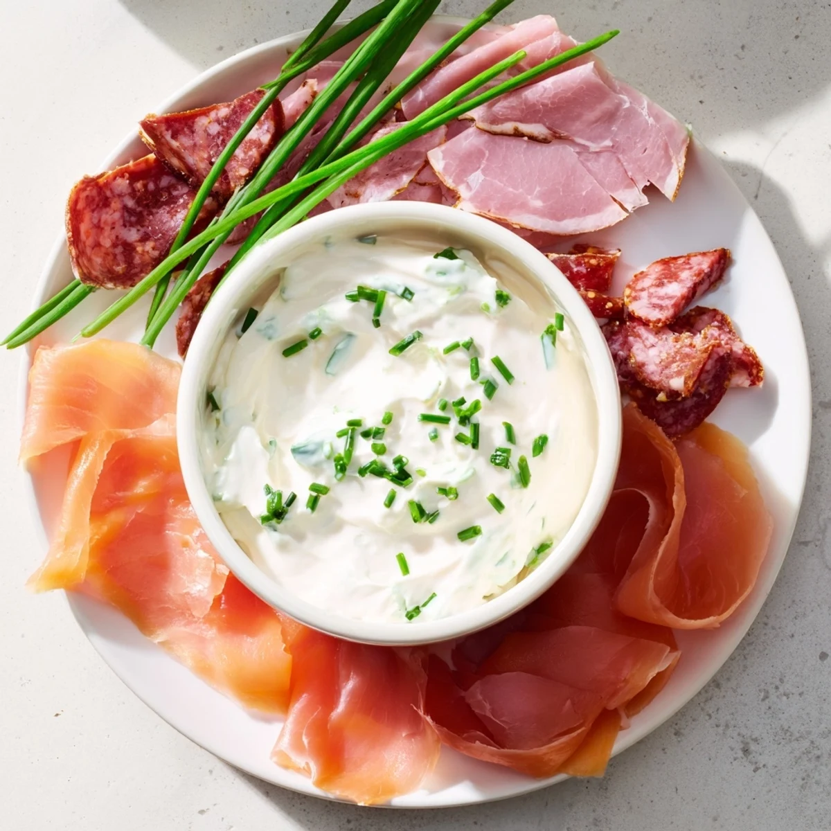 Inviting overhead shot showing a delicious, colorful "Compass Rose" appetizer with meats and garnishes.