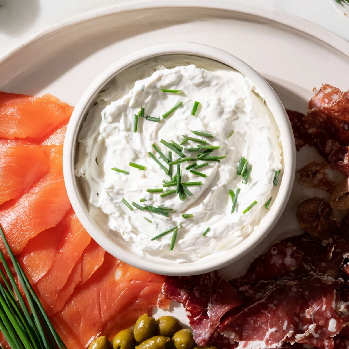 Gorgeous "Compass Rose" platter featuring smoked salmon, chorizo, prosciutto, roast beef, and a zesty dip.
