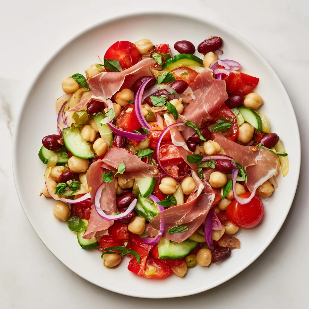 Vibrant Dense Bean Salad with Prosciutto: colorful ingredients tossed in a zesty vinaigrette with savory prosciutto ribbons.