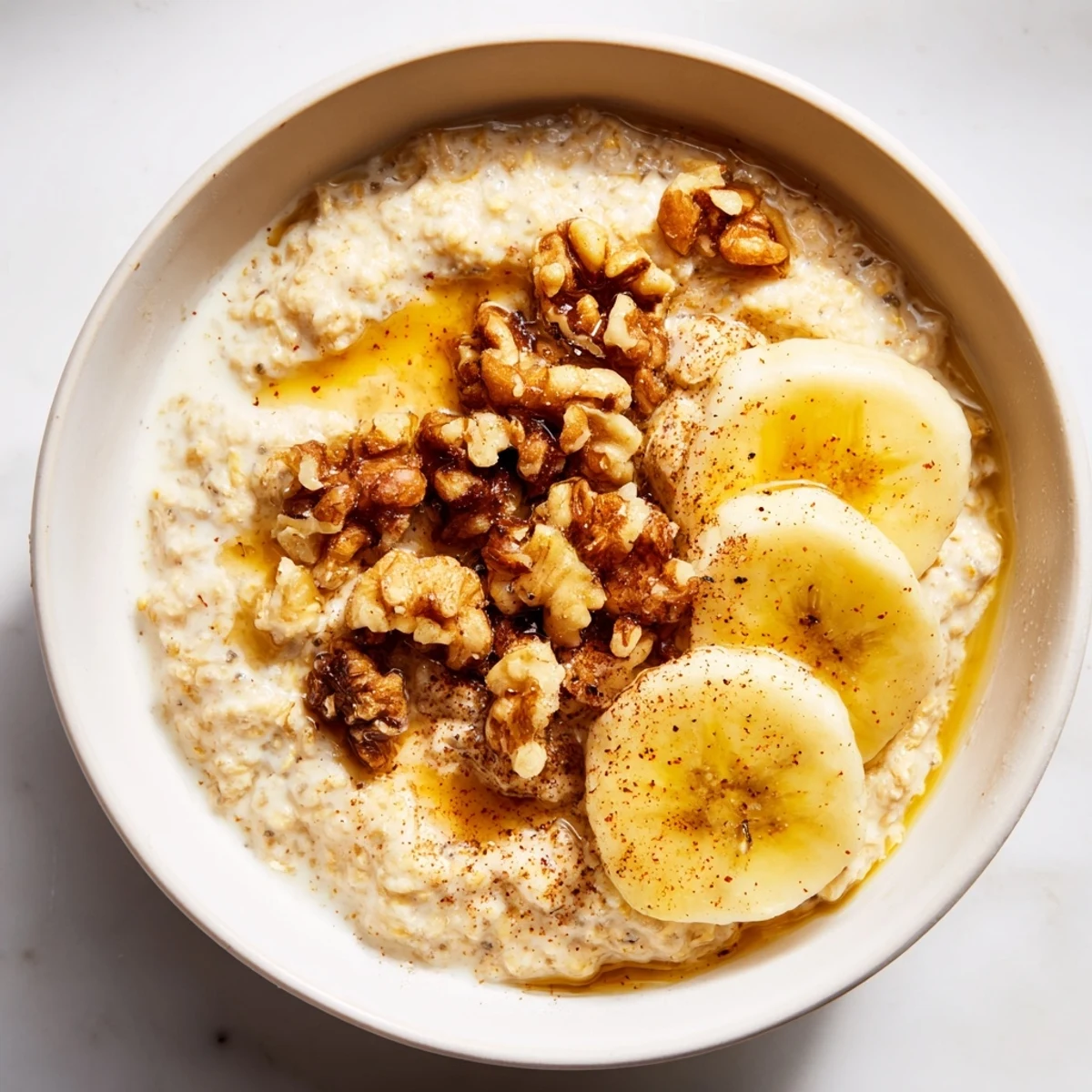 Steaming bowl of Microwave Banana Oats with sliced bananas, ready for a cozy breakfast.