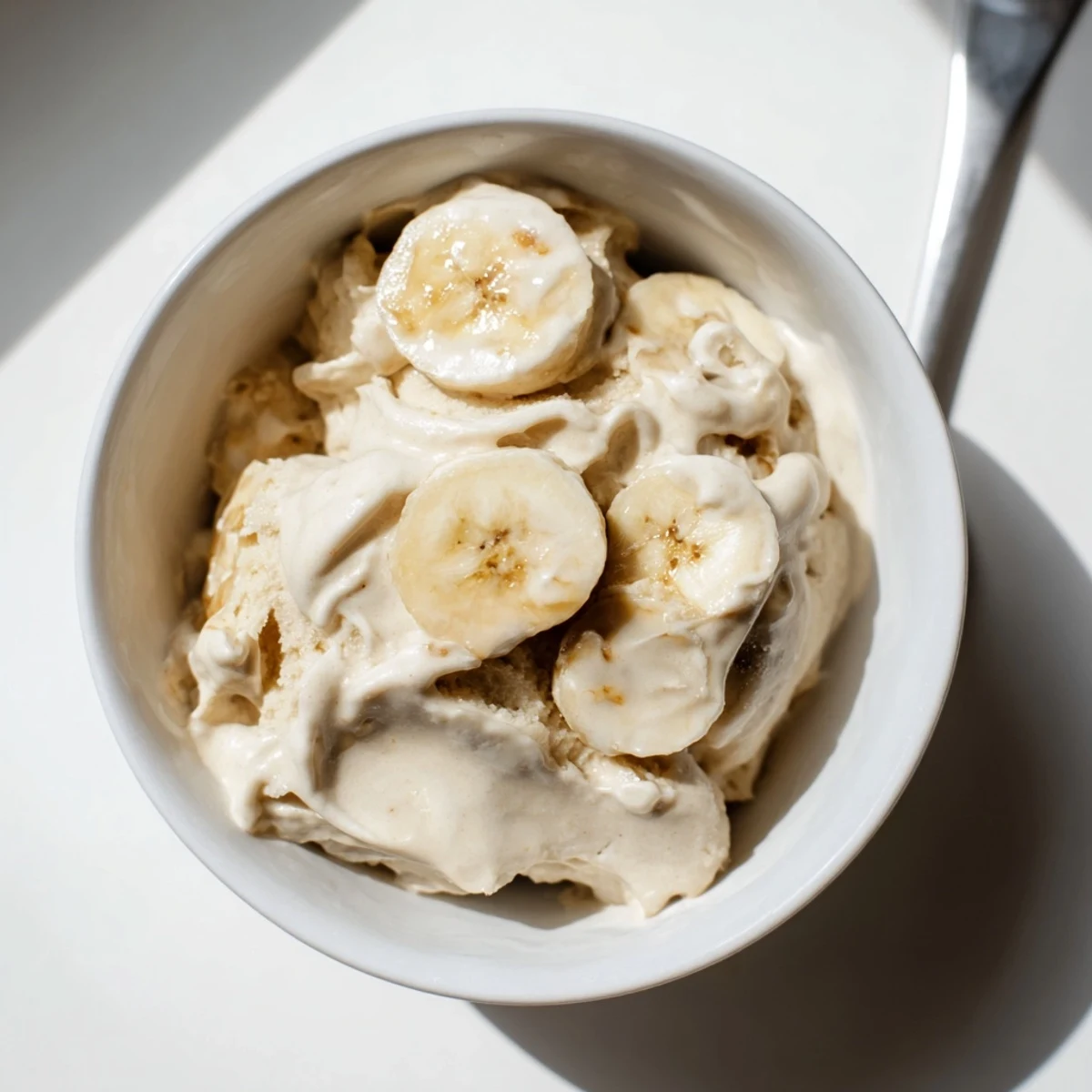 Whipped 2-Ingredient Banana Ice Cream, a cool, creamy vegan treat easily made at home.
