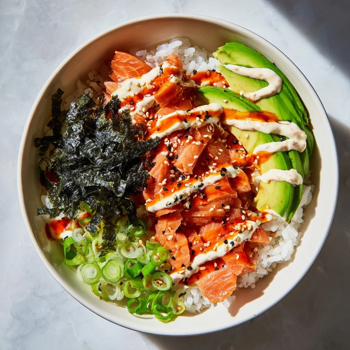 Flaked salmon and seasoned rice make up this delicious Classic Salmon Rice bowl topped with fresh avocado.