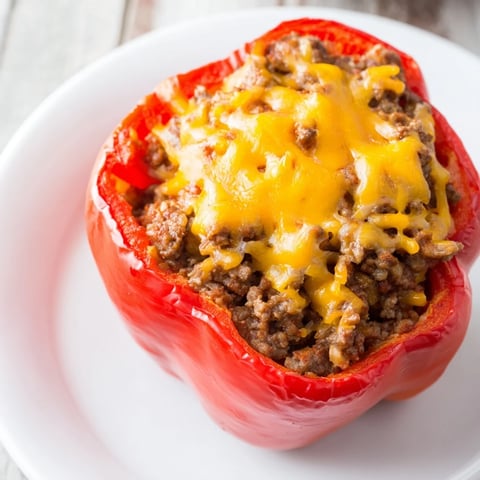 Golden brown Sloppy Joe Stuffed Bell Peppers filled with savory meat, ready for a comforting meal.