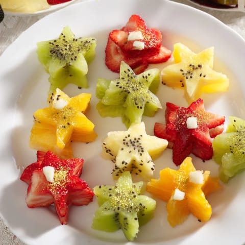 Midnight Kiss star & heart cocktail garnishes with shimmering edible gold dust, ready for festive drinks.