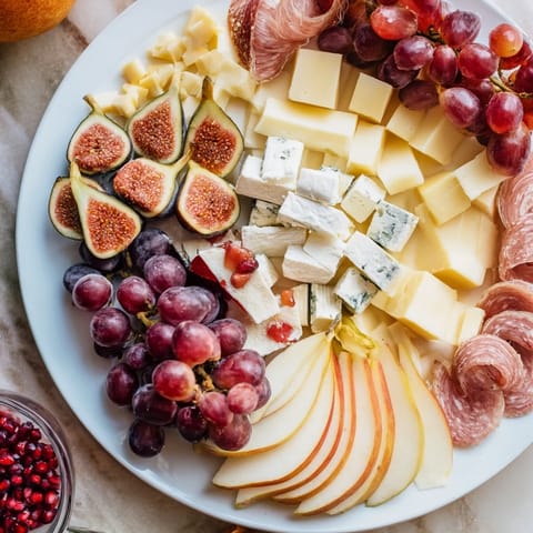 This stunning Moments Magiques Plateau Bonne Année 2026 recipe features artisanal cheeses, charcuterie, and fresh fruits.
