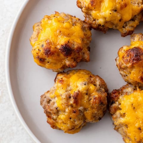 Homemade Chicken and Sausage Bisquick Balls, fresh from the oven, offering a delightful combination of flavors.