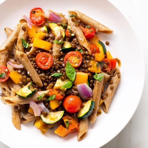 Warm and fragrant Lentil Pasta with Vegetables, a colorful Italian vegetarian dish with fresh herbs.