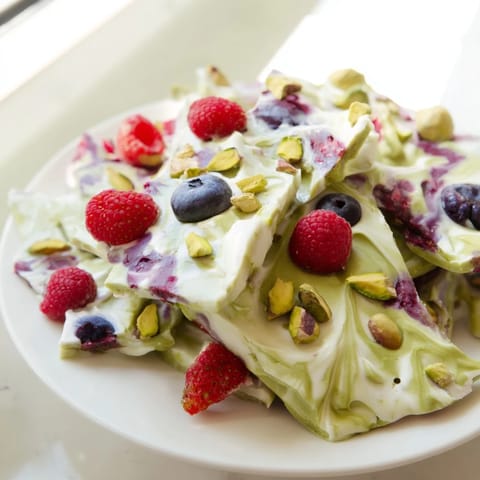 Vibrant frozen yogurt bark shows a beautiful swirl of flavors ready for a refreshing, healthy treat.