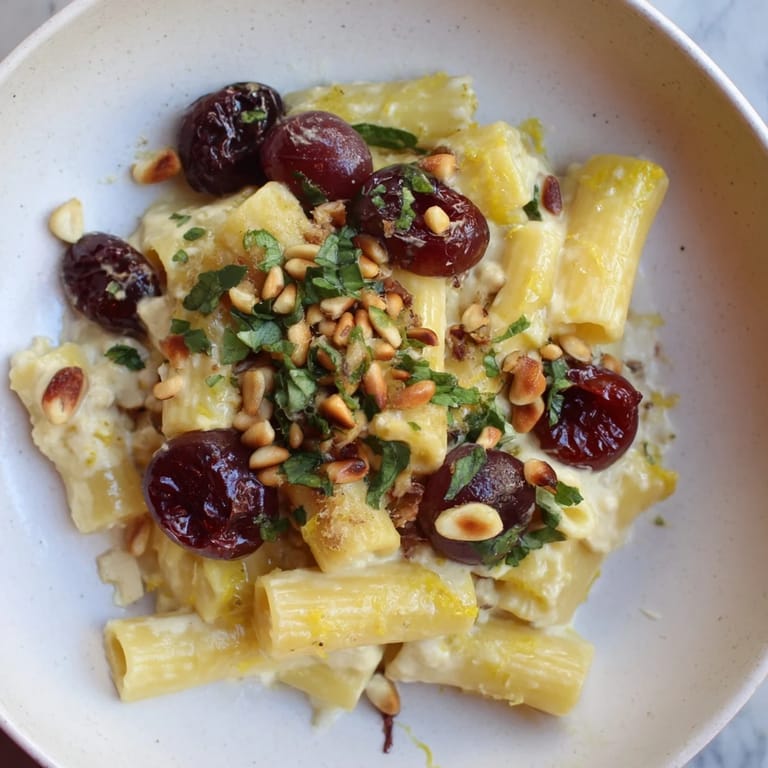 This Pasta with Roasted Grape dish features blistered, caramelized grapes adding a sweet, savory balance.